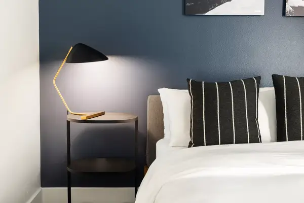 Details of bed and nightstand at Gravity Haus Truckee Tahoe