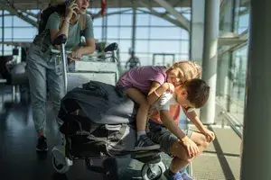 siblings playing at the airport 