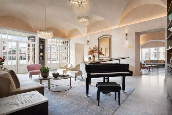 Lounge area with grand piano in Grand Universe Lucca