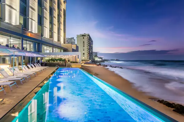 Infinity pool at dusk at Condado Ocean Club in San Juan, Puerto Rico