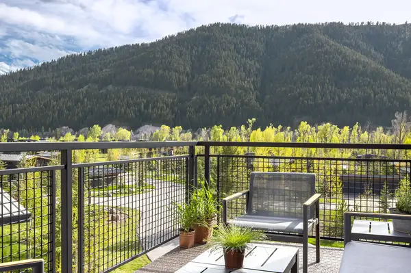 Patio with seating overlooking a mountain view