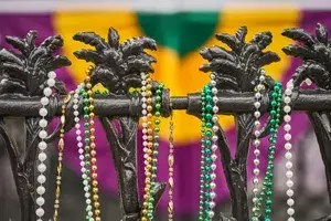 Mardi Gras Beads on an iron fence in New Orleans