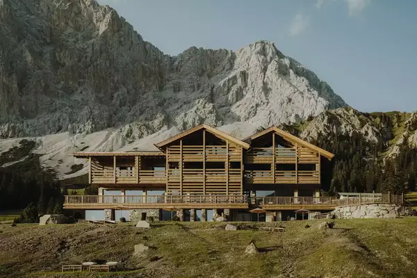distant view of a wooden lodge in the mountains