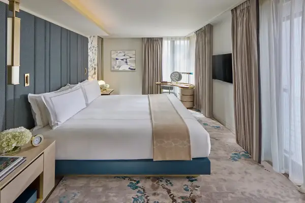 A hotel room with blue accents. 