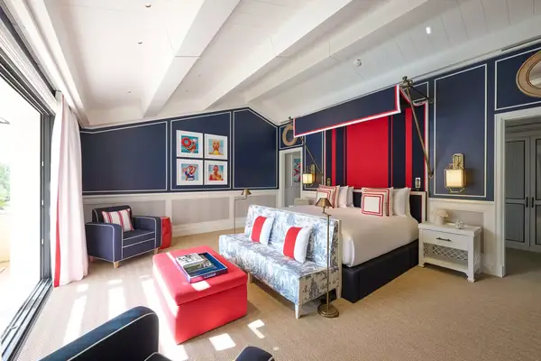 A red white and blue guest room at a hotel in France
