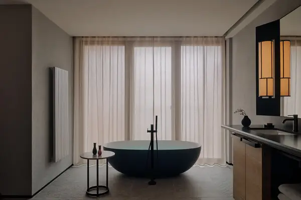 Stylish modern bathroom with a freestanding tub table and soft lighting