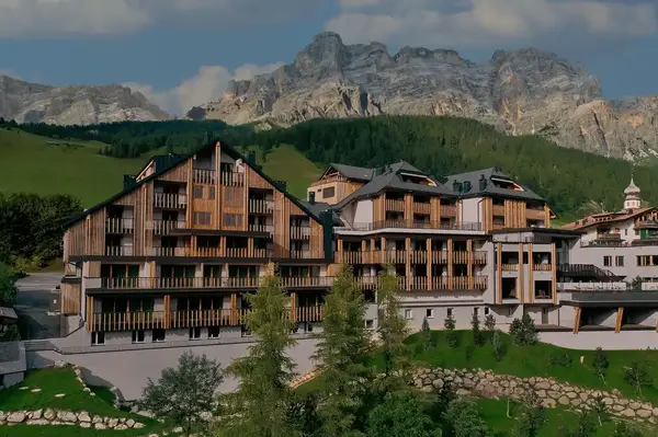 A luxury resort located in a mountainous area with multilevel buildings and alpine scenery