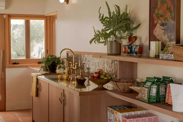 Breakfast bar with fruits, plants, and packaged food items