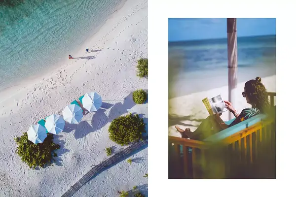 A beach resort and ocean seen from above; a woman reads on a beach chair