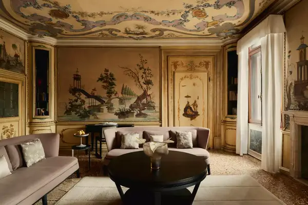 Guest suite at Aman Venice with a mural on the walls and ceiling