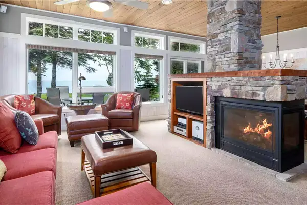 Living room with fire place at Larsmont Cottages