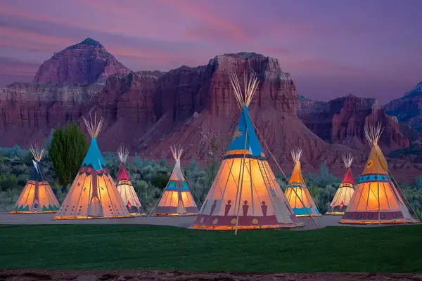 Teepees lit at night at Capitol Reef Resort
