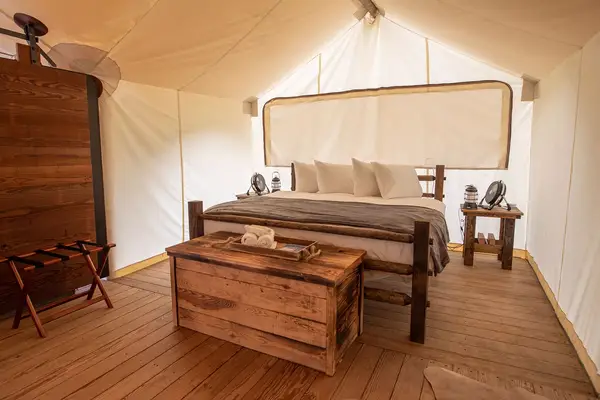 Interior of a bed at Under Canvas Great Smokey Mountains