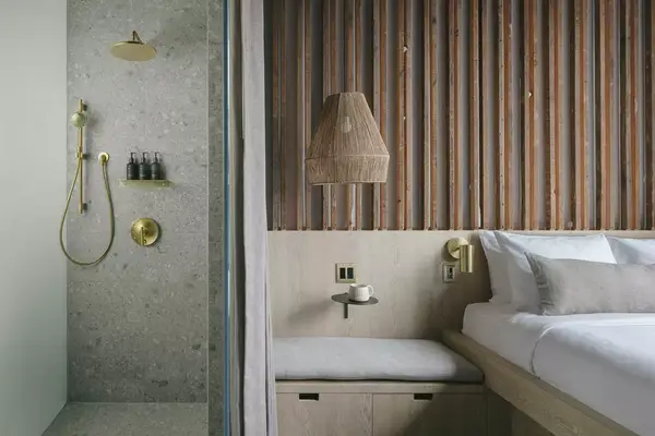 View of shower and bed in a Standard room at Drift Hotel Santa Barbara 