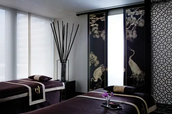 A serene spa room with massage tables and elegant decor