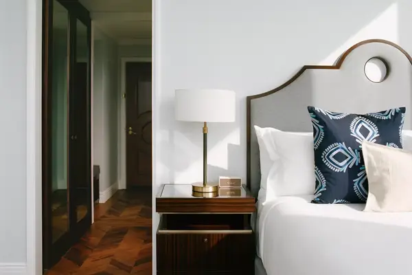 Bed and hallway in king room of Hotel Swexan