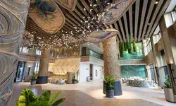 Interior view of the Polynesian resort lobby showcasing decorative columns and art