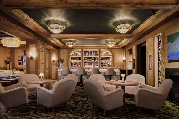 interior view of barstool with warmly lit room with many intimate seats