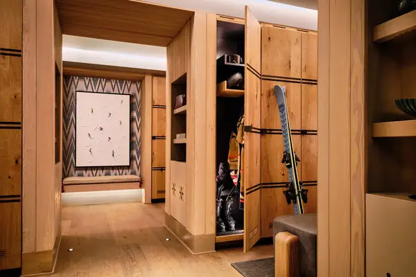 wooden locker room with skiing materials in the open locker on display