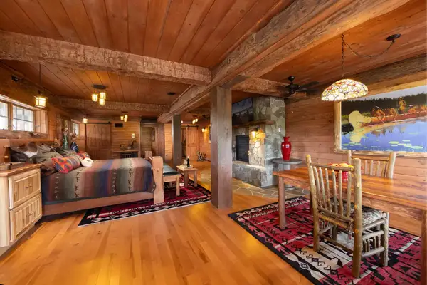 Inside a log cabin style guest room at a dude ranch in New York 