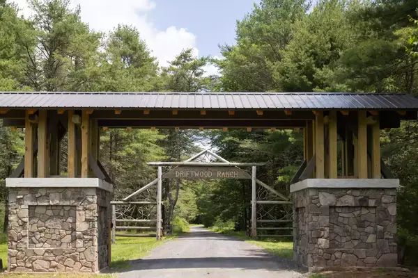 A stone gate to a dude ranch in New York