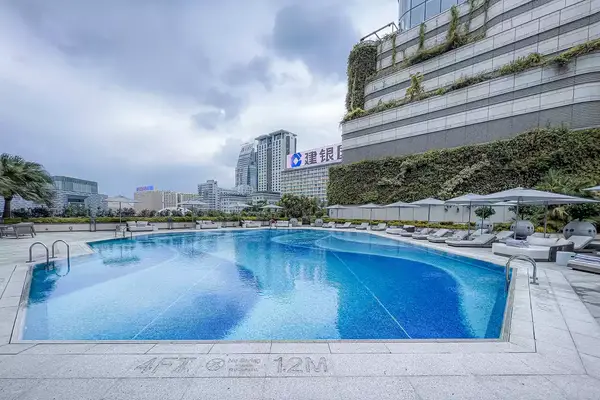 The exterior and the pool at the Regent Hong Kong