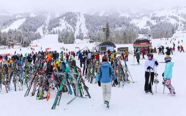 Skis resting on racks at the base of the ski slopes at Jackson Hole Mountain Resort