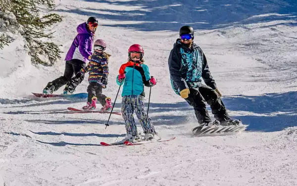 Family skiing at Smuggler