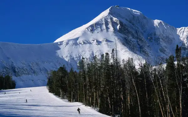 Skiers on a gentle run at Big Sky Resort in Montana.