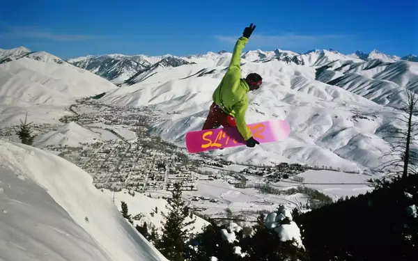 Snowboarder catches some air above Sun Valley Resort