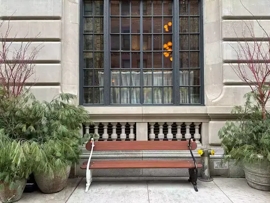 bench with two swans outside of Nine Orchard Hotel