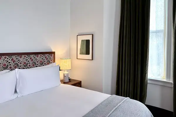 Interior guest room bed with window 