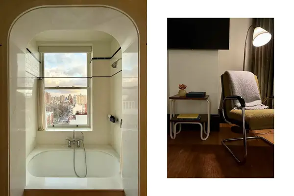 The guest room bath with city views and a cozy chair nook 