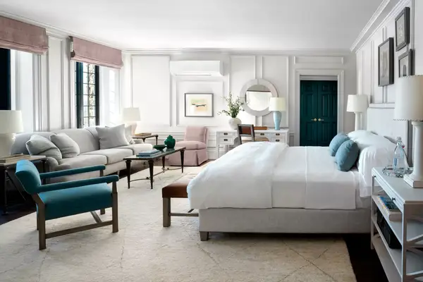 A white and blue toned guest room at The Ranch Hudson Valley