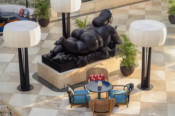 Sculpture by Fernando Botero displayed in an open seating area at Grand Wailea