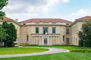 Museum with manicured lawn and blue sky