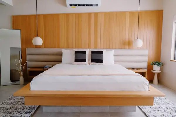 Interior space of king bedroom with kitchenette at Azure Sky hotel in Palm Springs