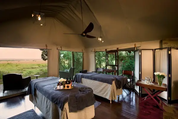 Luxurious safaristyle relaxation room with two treatment tables and panoramic views
