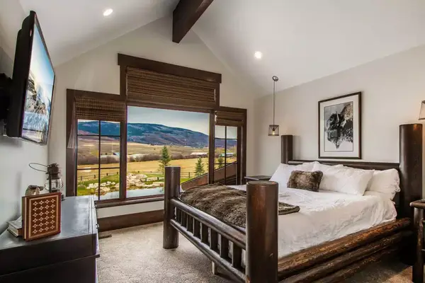 Bedroom with view of mountains from the window