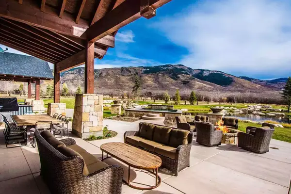 Back patio with view of backyard and mountains
