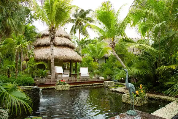 Seating overlooking a garden fountain in Little Palm Island Resort & Spa