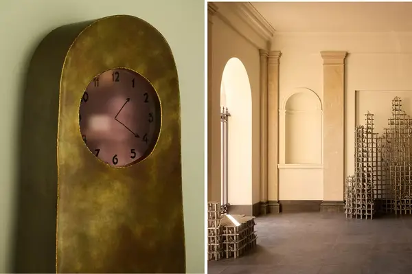 Art installation featuring a unique clock and a modern architectural interior with geometric structures
