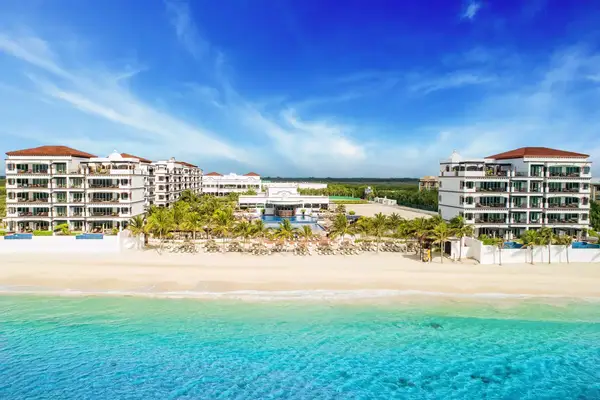 Drone shot of exterior hotel and beach area