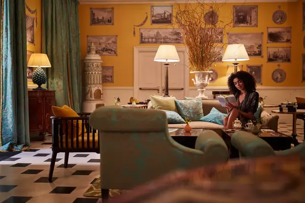 Woman reading in Julep Print Room at Hotel de la Ville 