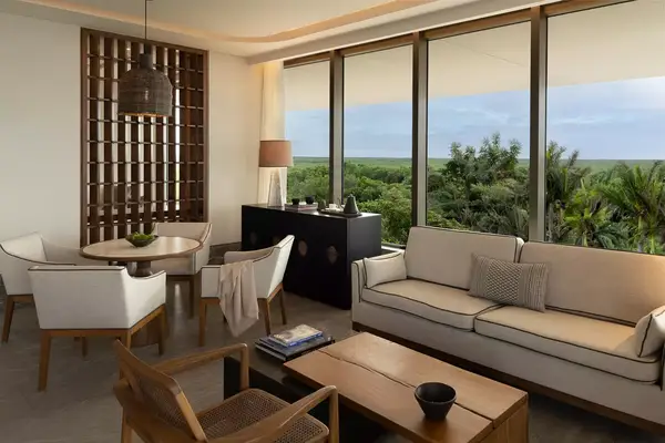 A guest room living and dining area at the SHA Wellness Center in Mexico