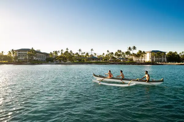 A family kayaking in Fairmont Orchid
