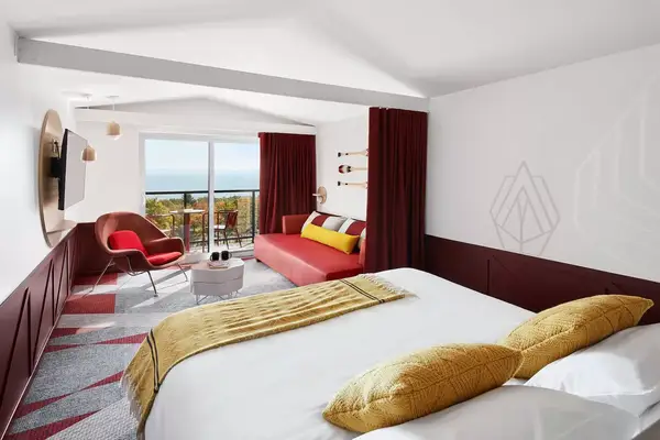 Bedroom with view of fall foliage