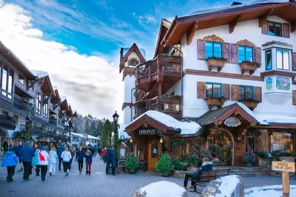 Vail, Colorado/USA-December, 30, 2018. Vail village,small town at base of Vail Mountain,gateway for winter sports.People walking next to stores, restarants, mountains in background. Lionshead Village.