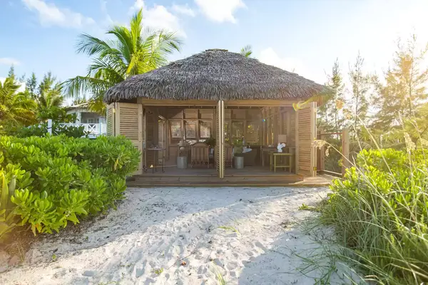 A beach bungalow at Kamalame Cay