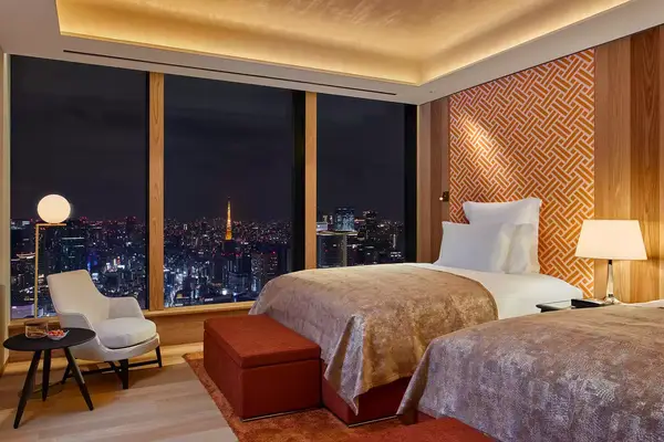 Guest bedroom with a view of Tokyo at night from Bulgari Hotel Tokyo